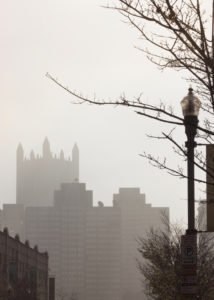 hazy buildings in downtown pittsburgh, pennsylvania, photographed by jamie bannon photography.