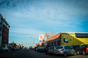 golden hour sun setting over buildings in the rino art district of denver, colorado, photographed by jamie bannon photography.