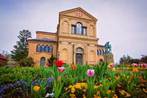 exerior of a franciscan monastery in washington, d.c. with tulips in bloom, photographed by jamie bannon photography.