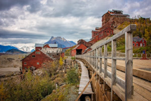 a footbridge leading to the old copper mine in kennecott, alaska , photographed by jamie bannon photography.
