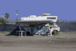 roadside mechanic reading a bible in baja california, mexico, photographed by jamie bannon photography.