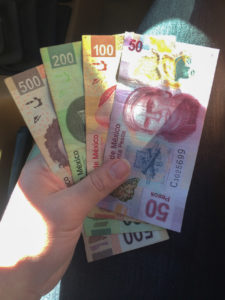 handful of pesos in ensenada, baja california, mexico, photographed by jamie bannon photography.