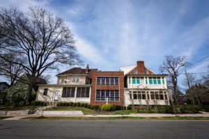 a large house with stained glass windows in washington, d.c., photographed by jamie bannon photography.