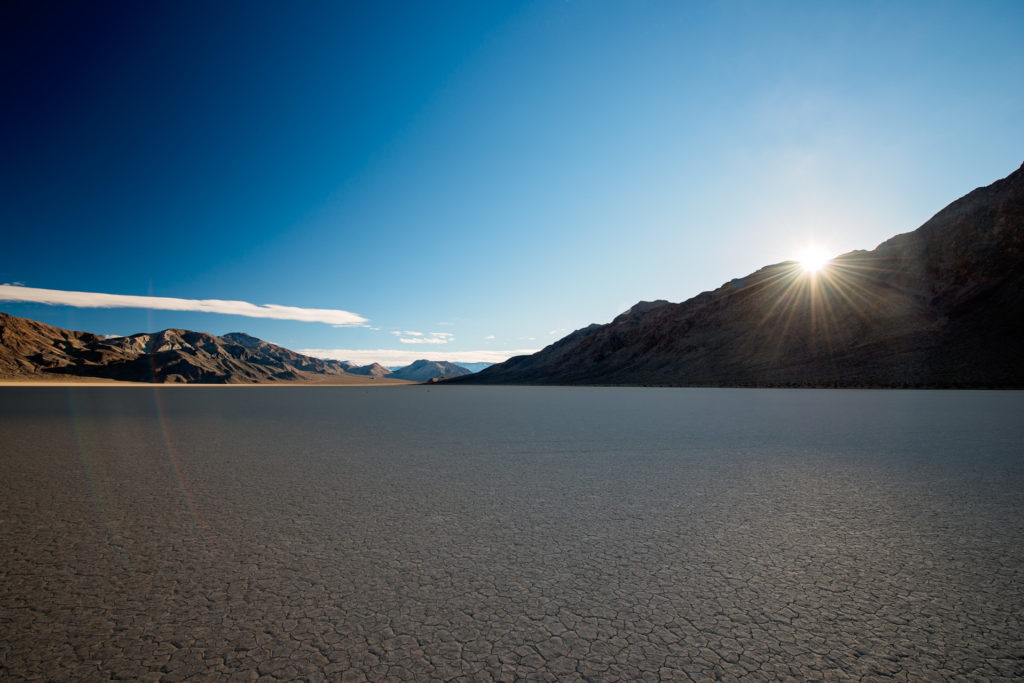 sunset over the racetrack playa in death valley, california, photographed by jamie bannon photography.