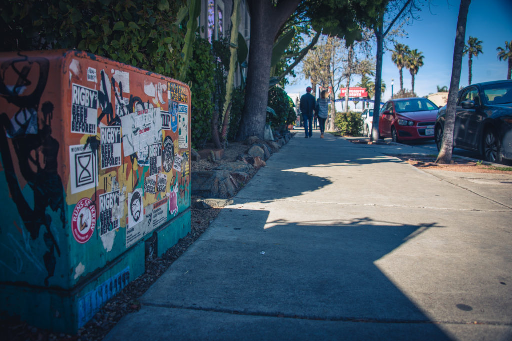 a transformer plastered with stickers in san diego, california, photographed by jamie bannon photography.