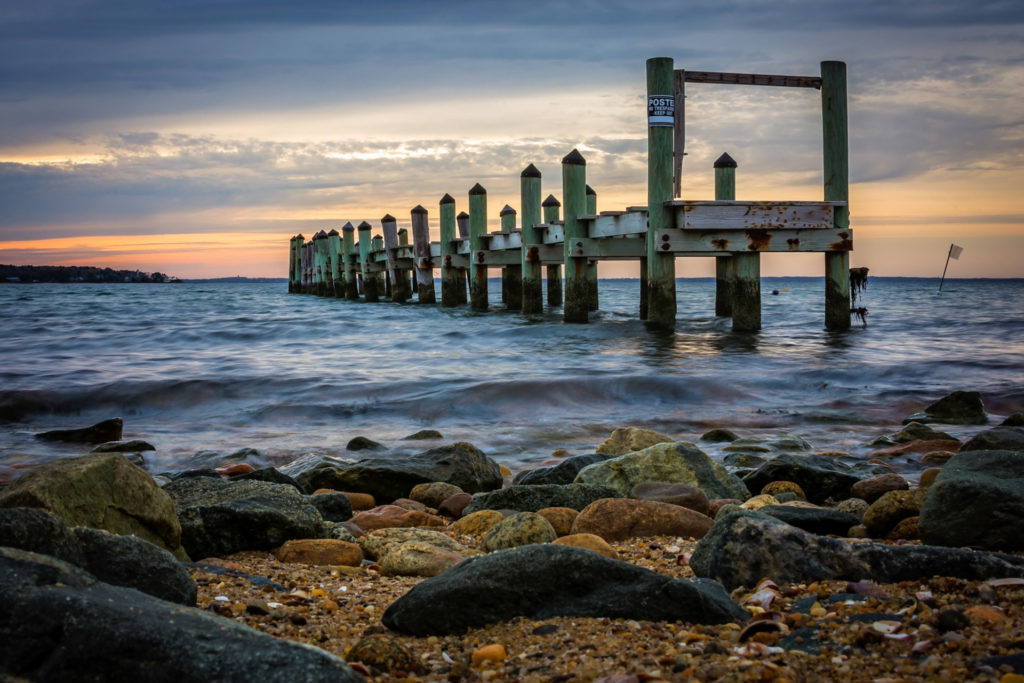 pier off the rocky coast of martha's vineyard, photographed by jamie bannon photography.