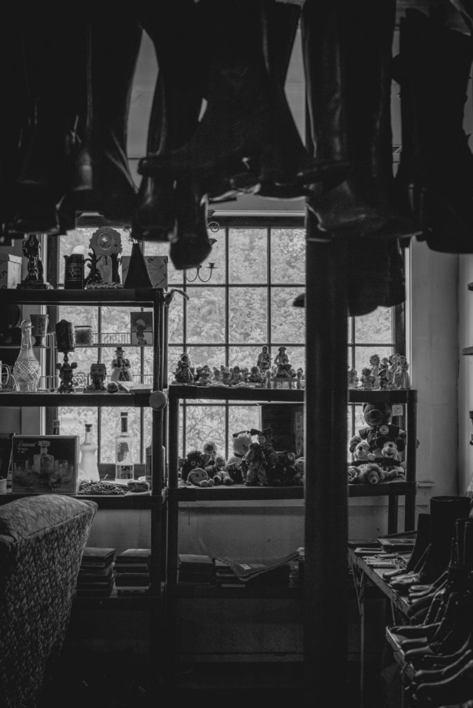 black and white interior of a cobbler shop in unionville, connecticut, photographed by jamie bannon photography.