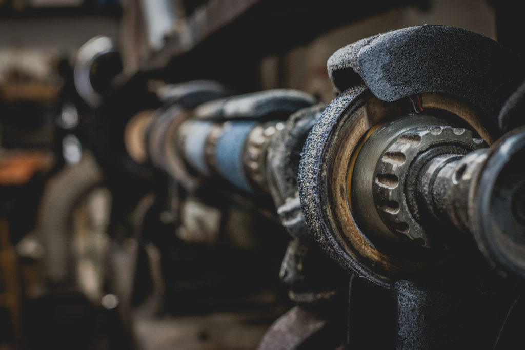 old fashioned shoe repair equipment in a cobbler shop in unionville, connecticut, photographed by jamie bannon photography.