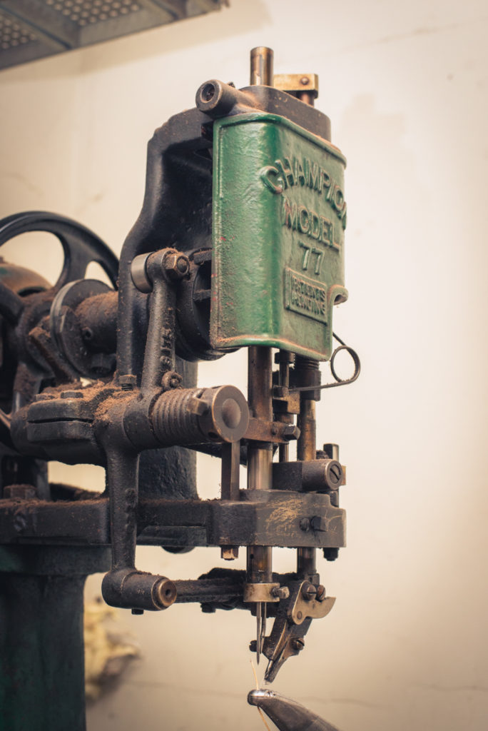 old fashioned shoe repair equipment in a cobbler shop in unionville, connecticut, photographed by jamie bannon photography.