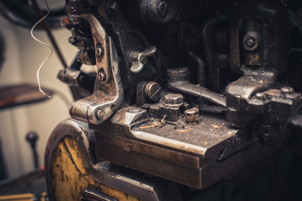 old fashioned shoe repair equipment in a cobbler shop in unionville, connecticut, photographed by jamie bannon photography.