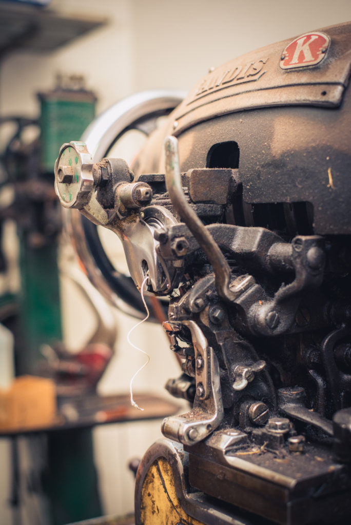 old fashioned shoe repair equipment in a cobbler shop in unionville, connecticut, photographed by jamie bannon photography.