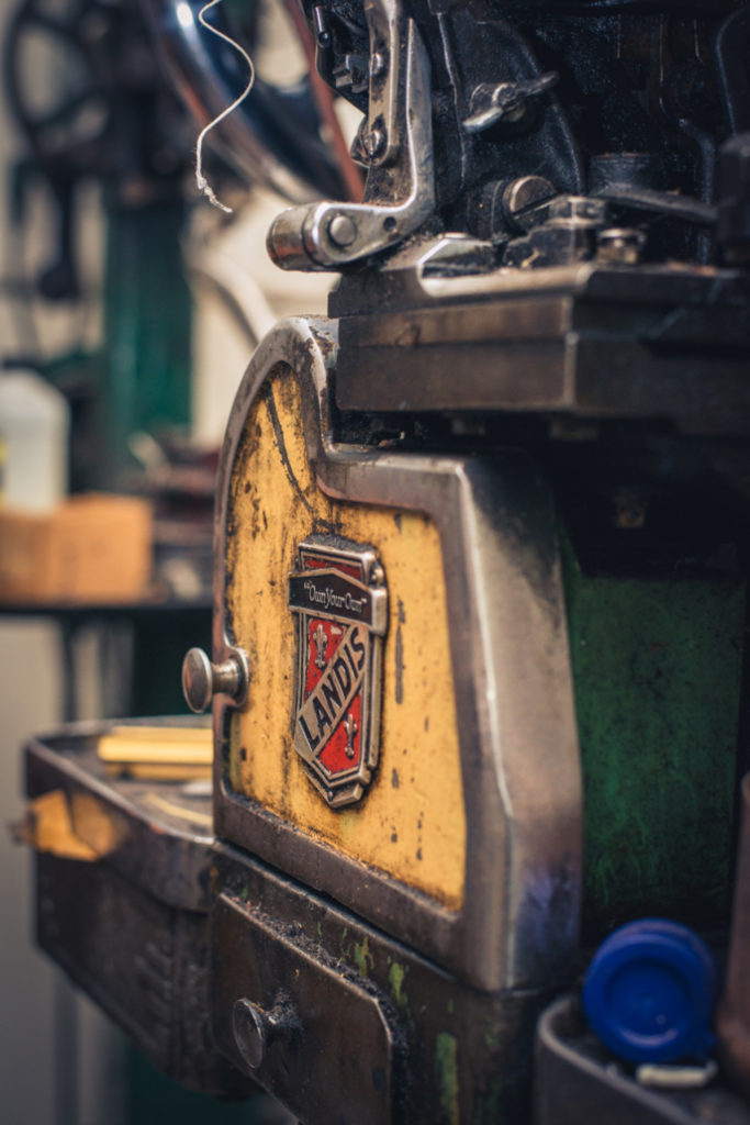 old fashioned shoe repair equipment in a cobbler shop in unionville, connecticut, photographed by jamie bannon photography.