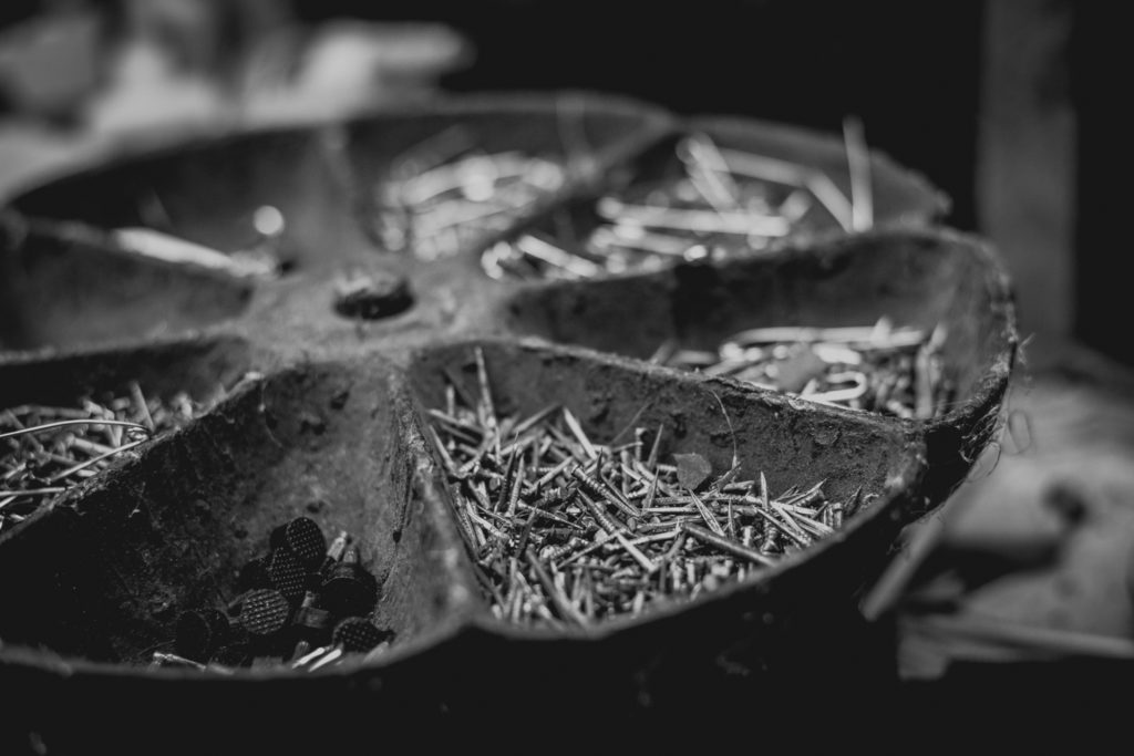 tray of shoe nails at a cobbler shop in unionville, connecticut, photographed by jamie bannon photography.