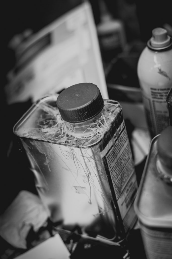 black and white detail of a cobbler shop in unionville, connecticut, photographed by jamie bannon photography.
