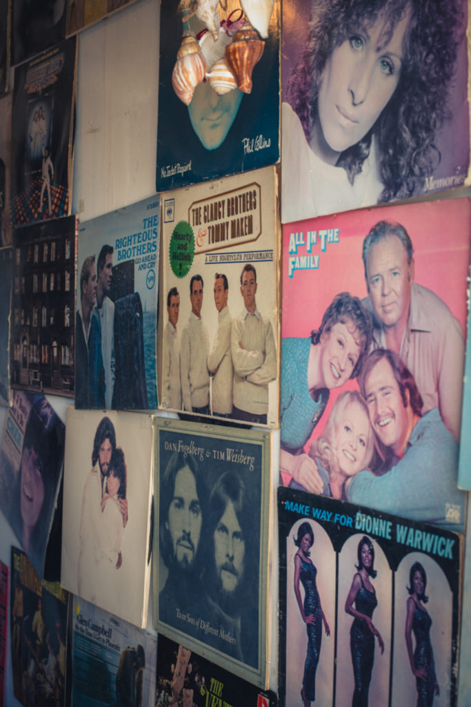 detail of old records hanging on the wall at a cobbler shop in unionville, connecticut, photographed by jamie bannon photography.