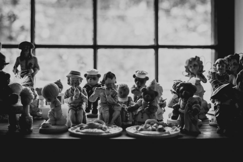 detail of knick knacks lining the shelves of a cobbler shop in unionville, connecticut, photographed by jamie bannon photography.