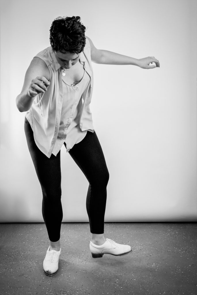 black and white portrait of a woman tap dancing, photographed by jamie bannon photography.