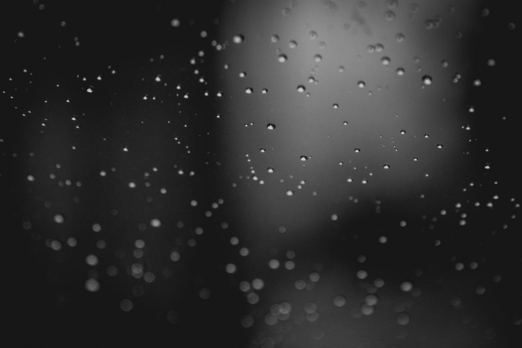 rain drops on the window of a car, photographed by jamie bannon photography.