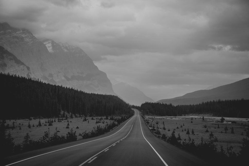 the icefields parkway through banff and jasper national parks in alberta, canada in black and white, photographed by jamie bannon photography.