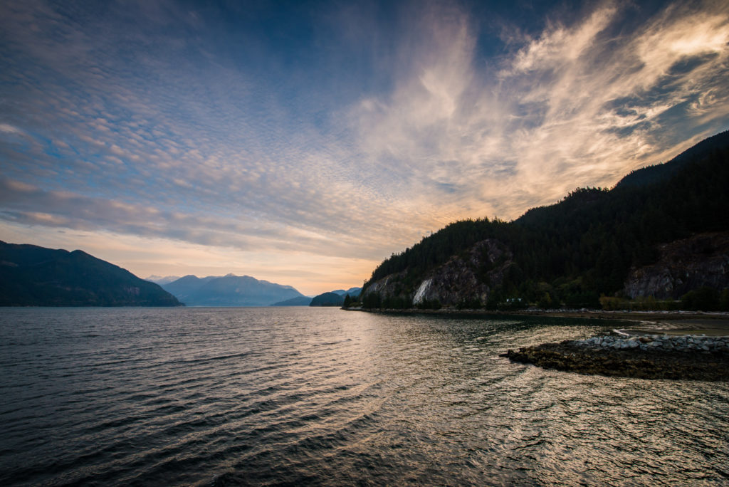 sunrise over the water at porteau cove provincial park, british columbia, photographed by jamie bannon photography.
