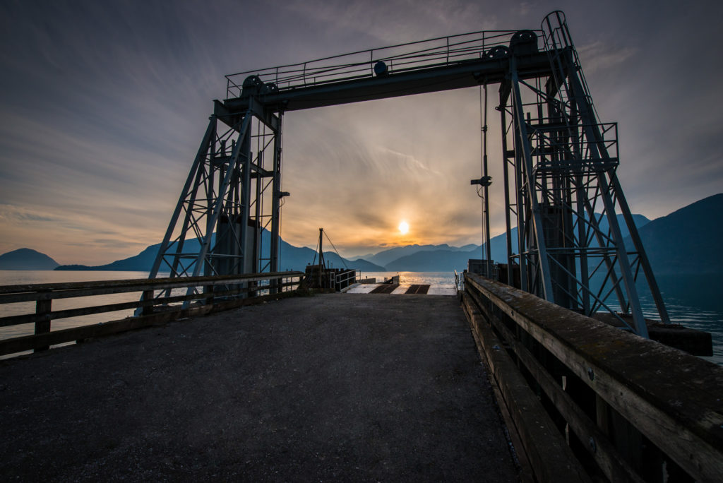sunset over the boat launch at porteau cove provincial park, british columbia, photographed by jamie bannon photography.